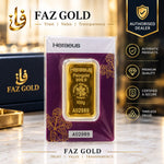 Heraeus 100g fine gold bar 999.9 sealed in tamper-evident assay packaging, on a FAZ GOLD authorised dealer display card