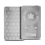 Two Royal Canadian Mint 10 oz fine silver 9999 bars showing the RCM seal face and the maple leaf textured face