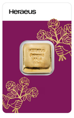 Heraeus 50g gold bar sealed in its magenta assay card with the Heraeus wordmark and rose pattern