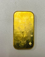 Reverse of the Metalor 100g cast gold bar showing the textured poured-gold surface