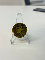 1 oz Canadian Maple Leaf gold coin on stand