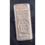 Heraeus 10 ounce silver bar photographed in hand, showing the poured finish and Heraeus hallmark