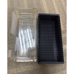 PAMP storage box with its clear lid slid off beside the black slotted tray